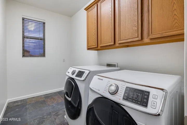 Laundry upstairs with room for baskets, folding table and more!