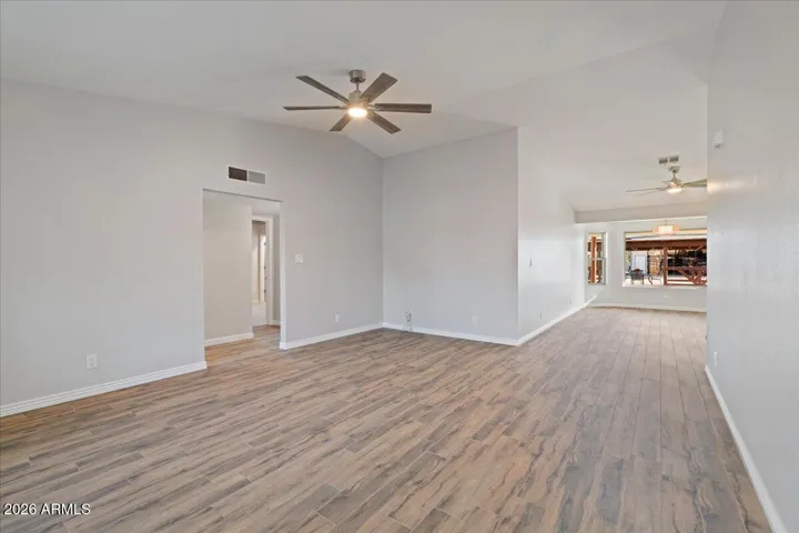 New Ceiling Fan with Adjustable Lighting and Porcelain Wood Plank Floor