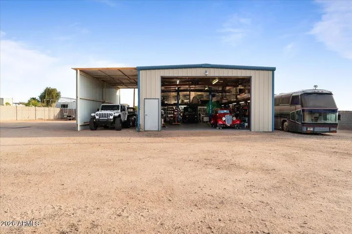 Large 30'x50' Insulated Shop with AC, 12,000 Pound Hoist and Covered RV Parking