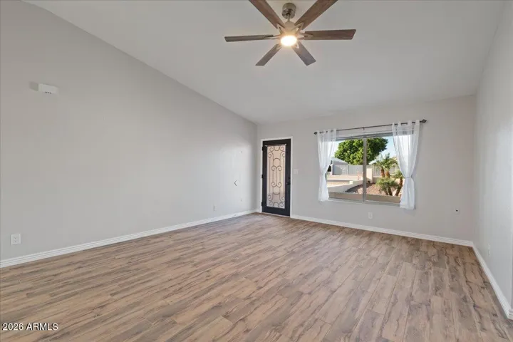 New Ceiling Fan with Adjustable Lighting and Porcelain Wood Plank Floor