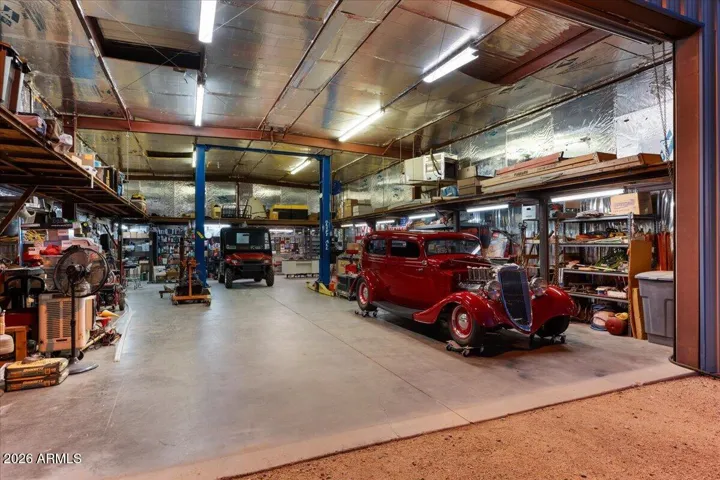 Large 30'x50' Insulated Shop with AC, 12,000 Pound Hoist and 600 SQFT of Upper Mezzanine Storage.