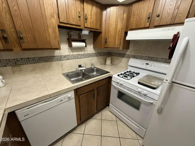 Gas stove, refrig and dishwasher in the kitchen, updated backsplash
