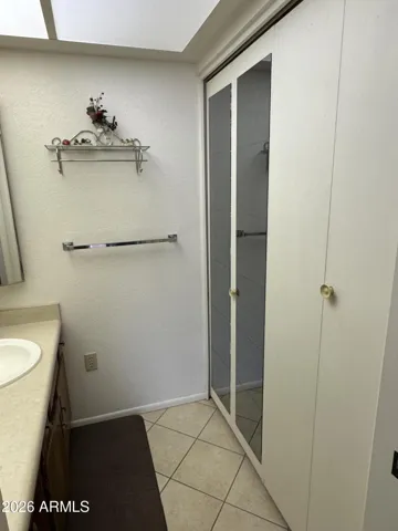 Large linen closet in dressing area