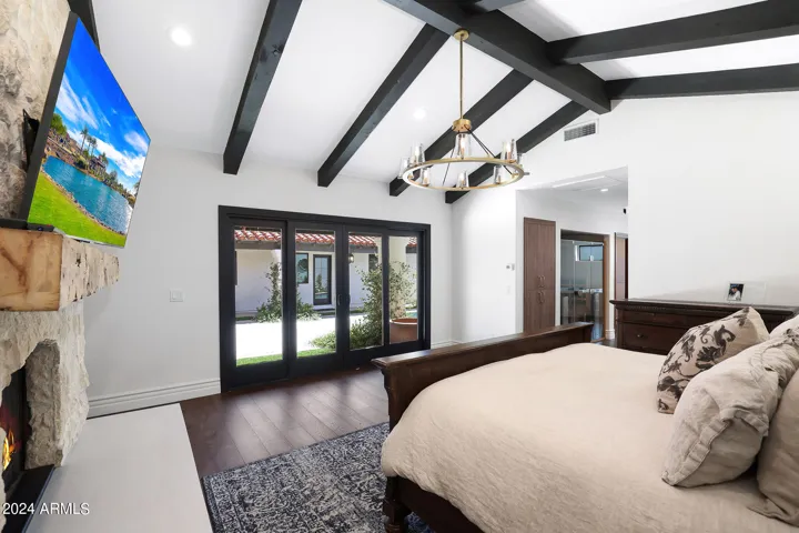 Primary bedroom with sliders to backyard/courtyard