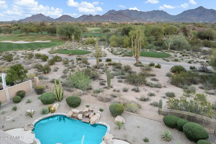 Enjoy panoramic mountain and golf course views from the entire east side of the home