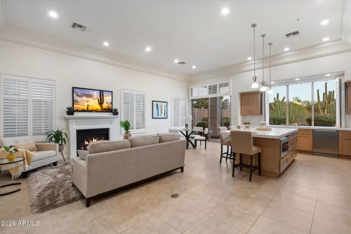 Great room includes fresh paint, new light fixtures, and a fully remodeled kitchen