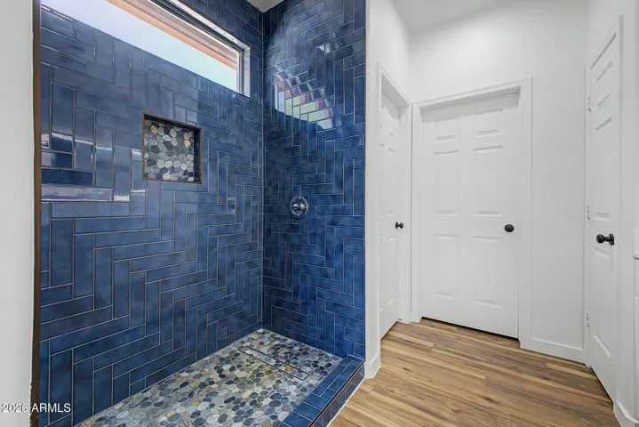 Updated Primary Suite with Stunning Tiled Walk-in Shower.