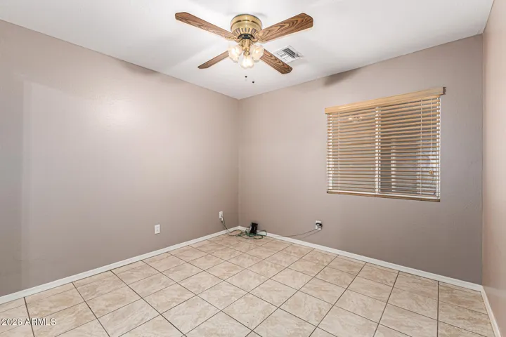 2nd bedroom with tile and closet