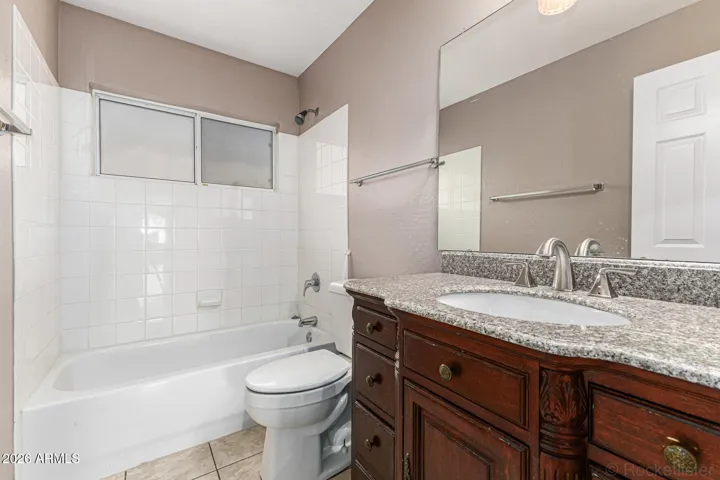 2nd bathroom with updated taller vanity height and clean tub.