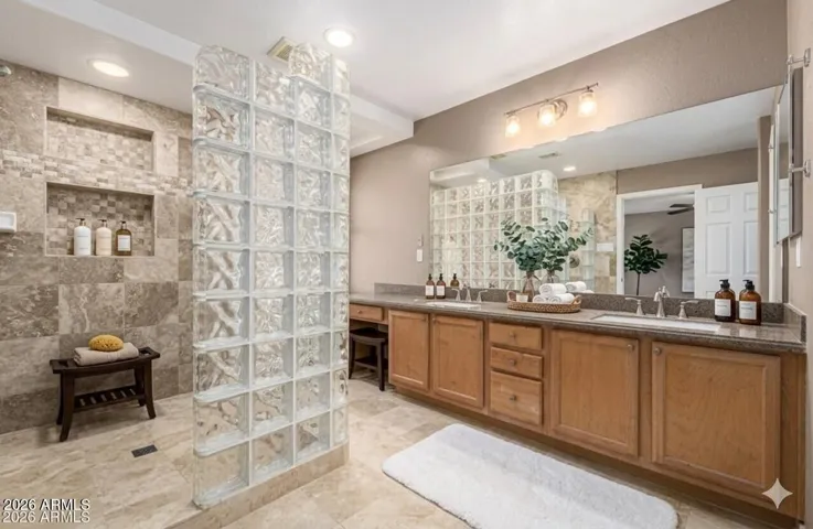 Large primary bathroom with updated and extended walk-in shower