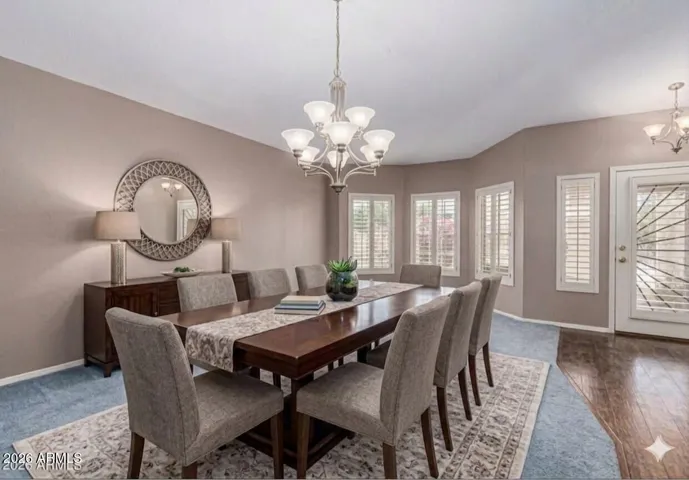 Open Dining or Family Room space with picturesque windows & brand new carpet.