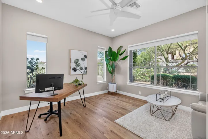 Versatile Scottsdale home office with large windows, natural light, and low maintenance flooring, ideal for remote work or flex living space. The layout offers the unique potential to be reconfigured into a soundproofed work-from-home casita with its own private entrance.