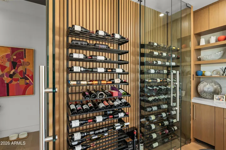 Custom wine display case which hold up to 240 bottles with additional case storage below