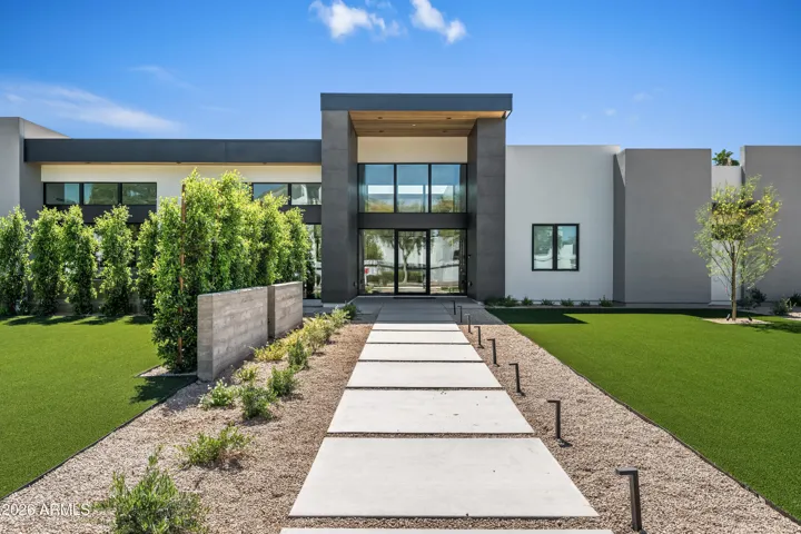 Front exterior front entrance showcasing architectural elements in balance with outside environment