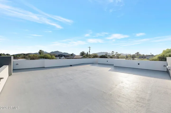 Spacious rooftop deck with panoramic views and open-air design. This Paradise Valley home offers an elevated outdoor living experience perfect for relaxing or entertaining. Unfurnished