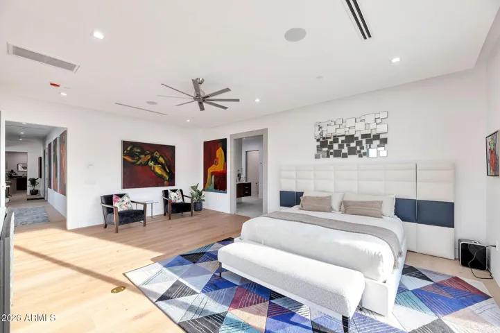 Expansive primary suite with a private sitting area, designer finishes, and open layout. This Paradise Valley home offers comfort, space, and luxury living with updated features.