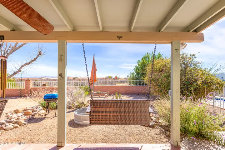 The backyard is defined by a custom view fence, featuring pillars with open-iron insets. It’s a design that ensures you are never "fenced in," but rather perfectly framed within the landscape—allowing the desert’s beauty to flow right to your back door.