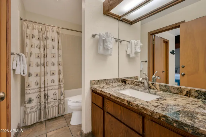 Private - tub / shower combo with vanity.