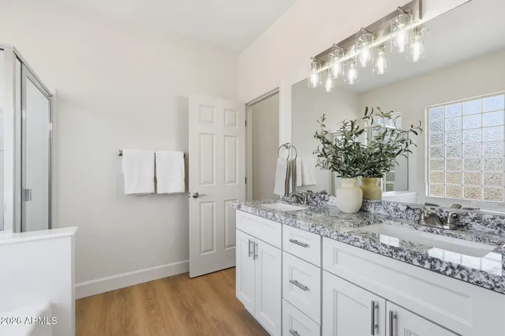 Bright and all-new primary bath- functional, sleek, and ready for you