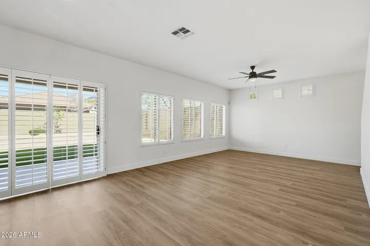 Family room with plenty of natural light and a seamless connection to the kitchen and backyard