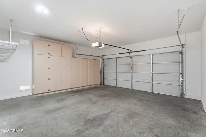 Garage with built-ins and hanging racks - perfect for tools, toys, or gear