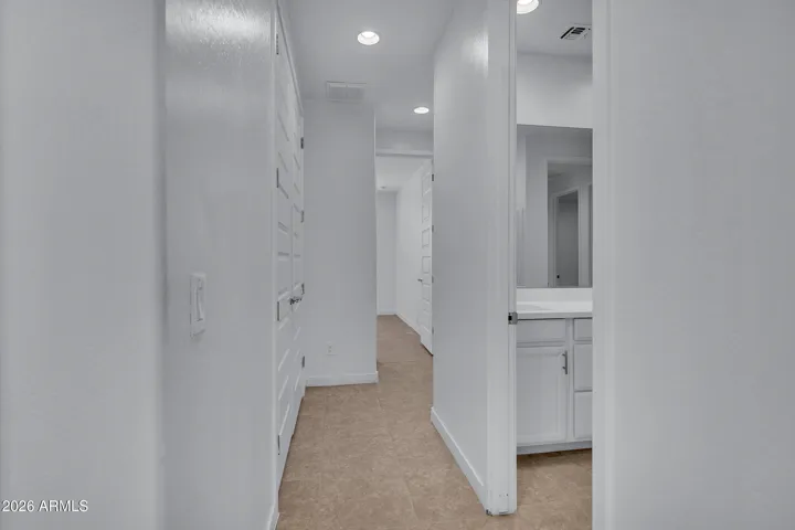 Hallway to bedrooms and garage