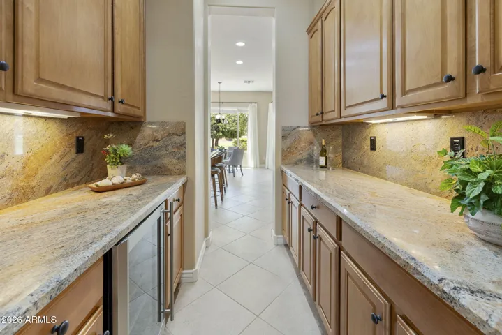 Butlers pantry is so convenient for entertaining and storing barware and serving dishes.
