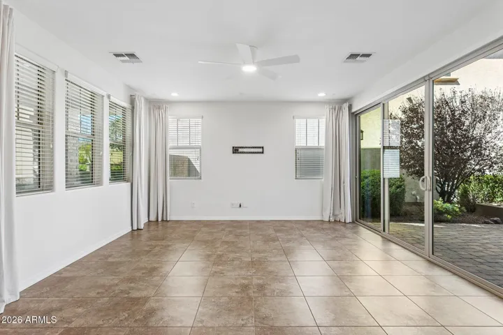 Ceiling fan, recessed lighting, and window treatments. Entire interior was just repainted (March 2026)
