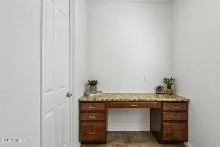 Office nook with a built-in desk just off the kitchen