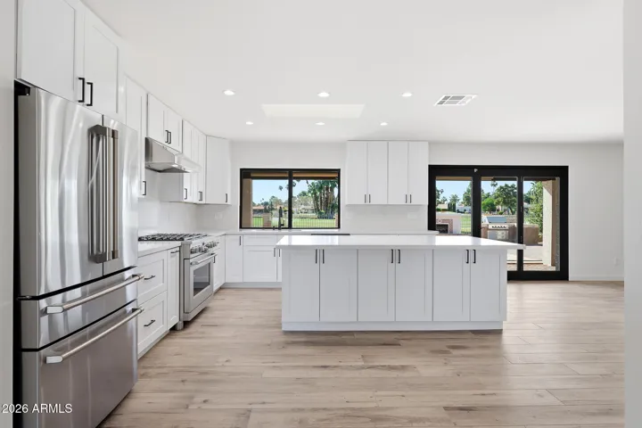 Fresh kitchen. Golf course view. Easy access to backyard grill.