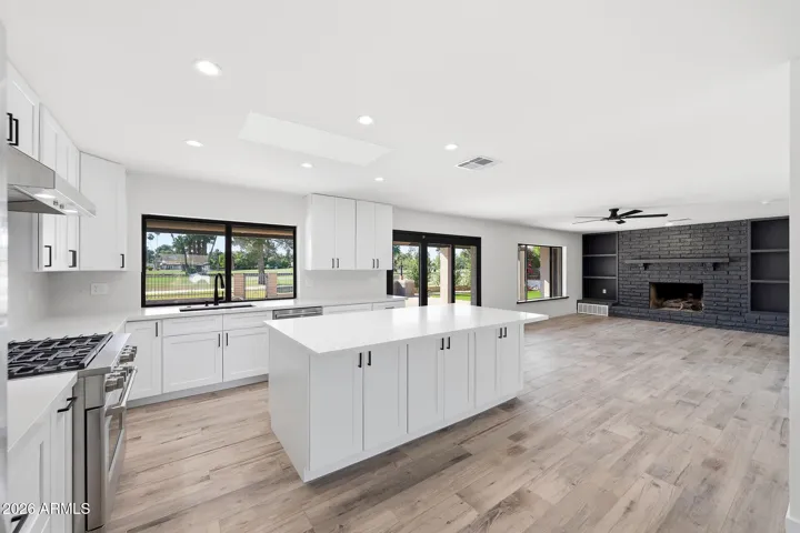 Fresh kitchen. Golf course view. Easy access to backyard grill.