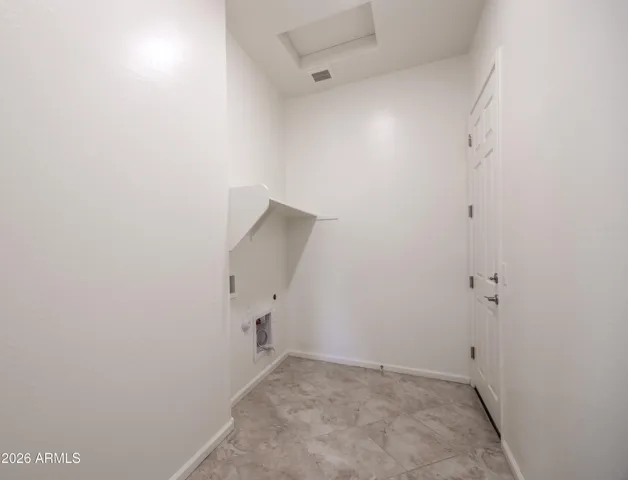 Main Living Laundry Room With Entrance to Garage.
