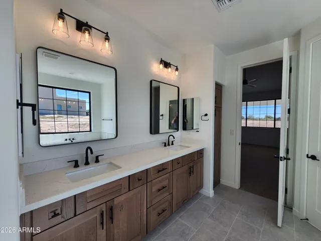 DOUBLE VANITY IN THE MASTER BATH. PICTURE IS OF A PREVIOUSLY BUILT SPEC.