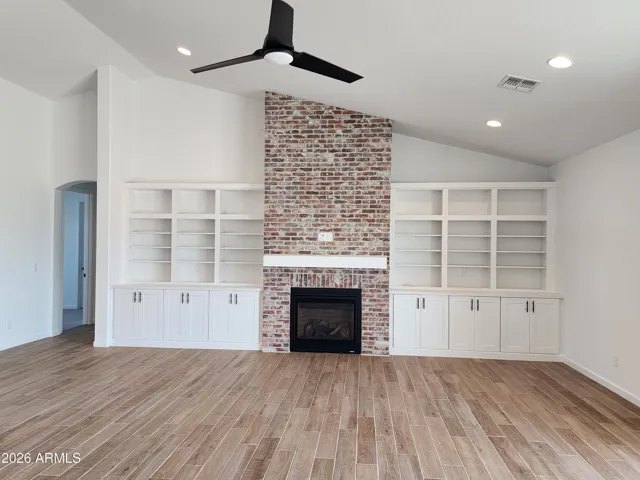 HUGE GREAT ROOM WITH FIREPLACE. LARGE OPEN KITCHEN WITH ISLAND. PICTURE IS OF A PREVIOUSLY BUILT SPEC.