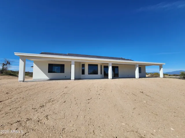 FULL WIDTH COVERED REAR PATIO. PICTURE IS OF A PREVIOUSLY BUILT SPEC.