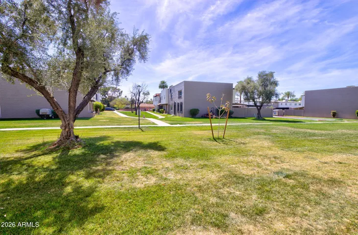 Common area infront of clubhouse and pool. A few units north of the property.