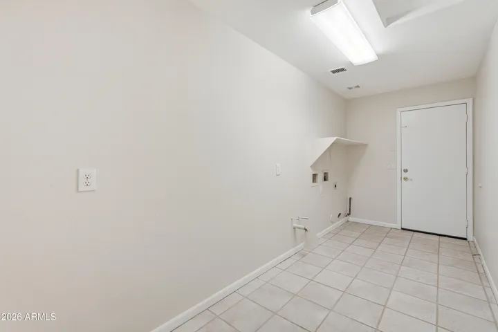 Laundry room with garage door access