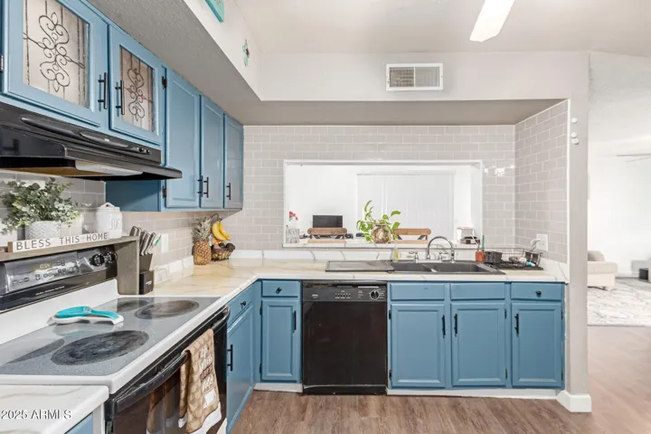 Kitchen:
Cute and functional kitchen with modern updates, ample cabinet space, and a cozy, inviting feel.