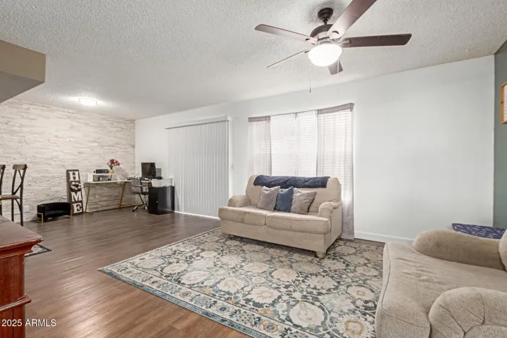 Living Room:
Bright and welcoming living space with plenty of natural light — perfect for relaxing or entertaining.