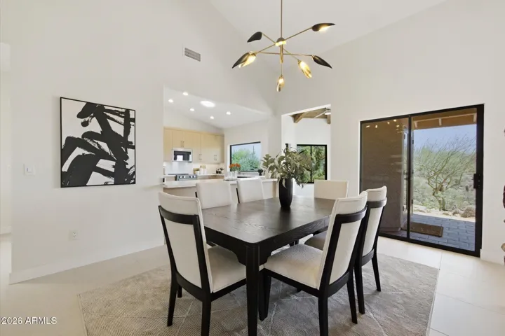 Bright and spacious dining area, perfectly integrated with the gourmet kitchen and featuring high ceilings.