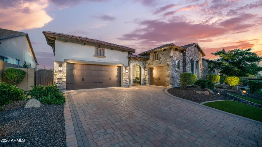 Paver Driveway Leads to a Private Gated Courtyard Entry