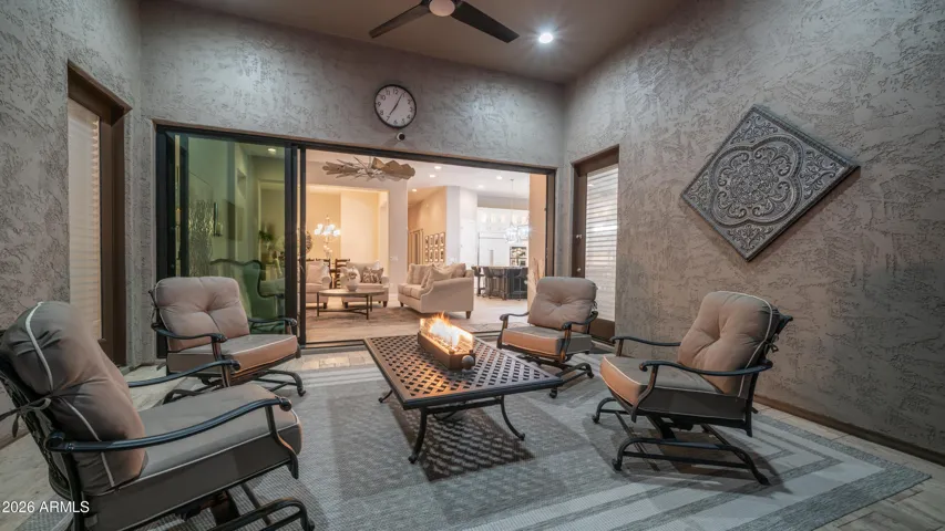 Relax Fireside While Enjoying the Peaceful Backyard Oasis