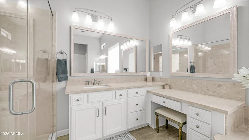 Thoughtfully Designed Dual Vanities with a Seated Makeup Station