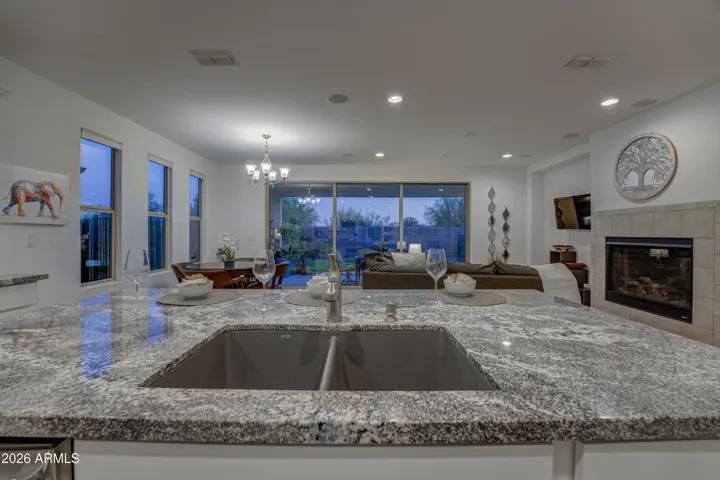 Looking out to backyard with fully retractable door