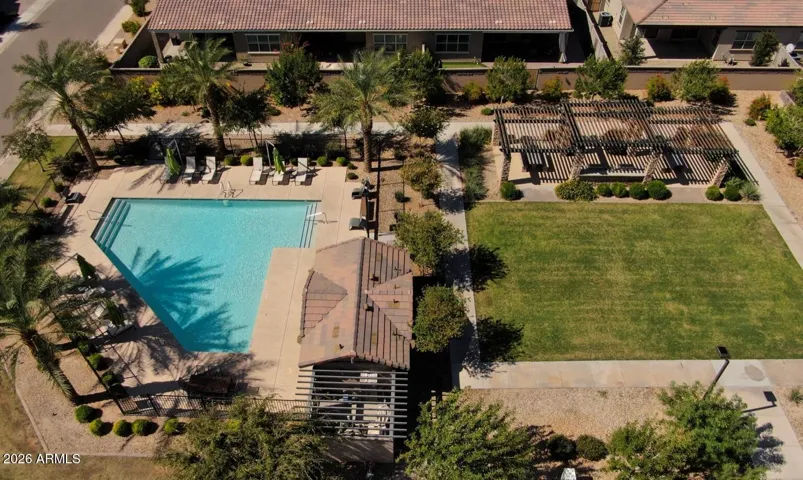 Just steps away from the community pool, shaded BBQ pavilion, and park