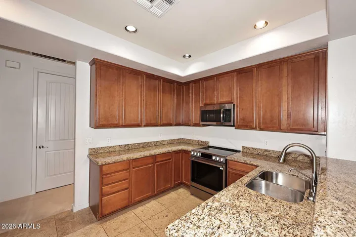 Kitchen features granite countertops