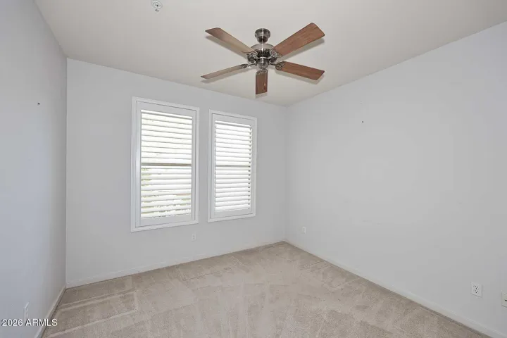 Bedroom 2 has ceiling fan, plantation shutters