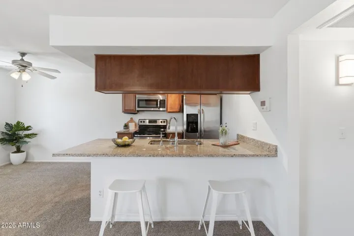 Functional kitchen with easy access to the main living areas, perfect for hosting or everyday cooking in this Scottsdale condo near Old Town.