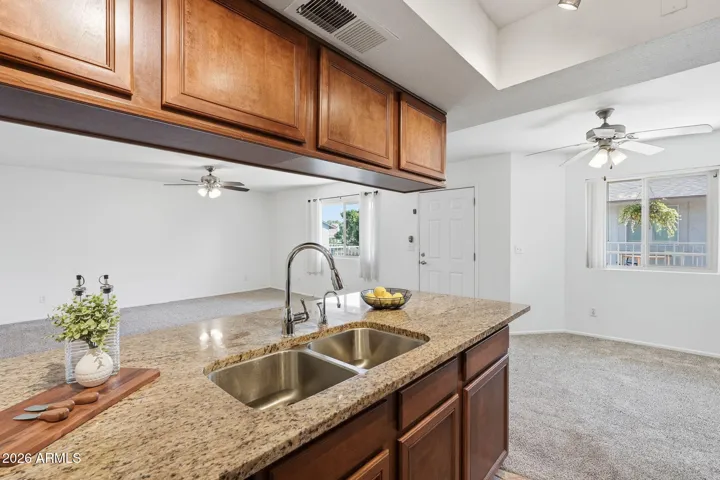 Kitchen layout offering ample counter space and visibility into the open living area, creating a connected and practical living environment.