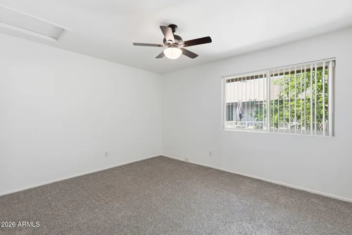 Versatile second bedroom perfect for guests, a home office, or flexible living space.